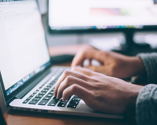 Hands on laptop keyboard