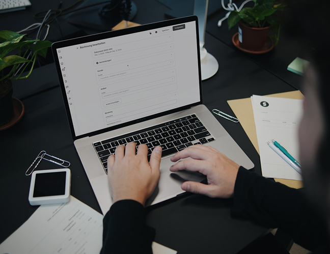 Hands on a laptop